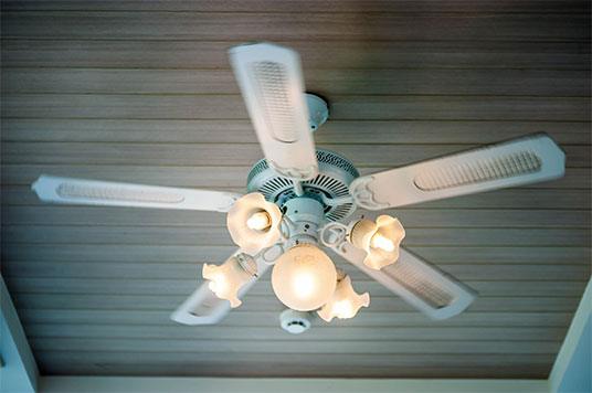 newly installed porch ceiling fan with lights attached