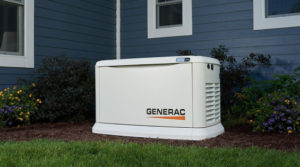 Generac brand generator located in the yard of a house.