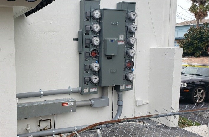 electric meter against a white exterior wall